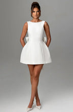 Short women's dress with decorative bow at the back