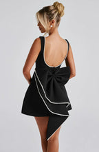 Short women's dress with decorative bow at the back