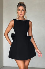 Short women's dress with decorative bow at the back