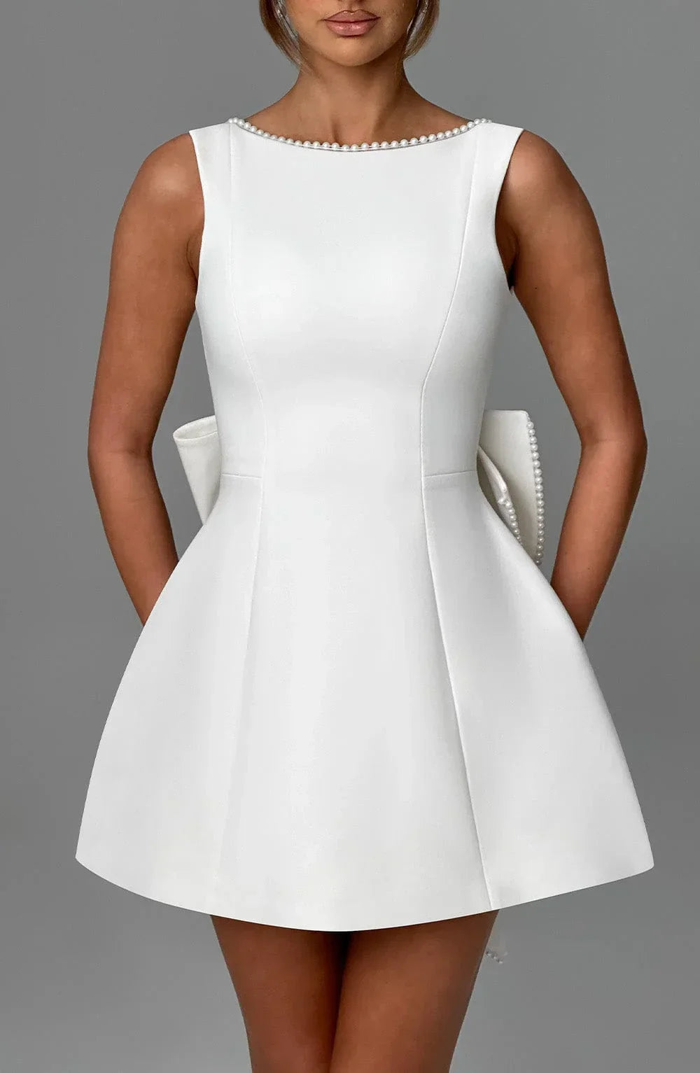 Short women's dress with decorative bow at the back