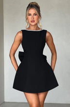 Short women's dress with decorative bow at the back