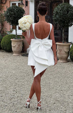 Short women's dress with decorative bow at the back