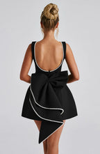 Short women's dress with decorative bow at the back