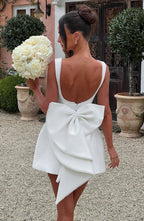 Short women's dress with decorative bow at the back