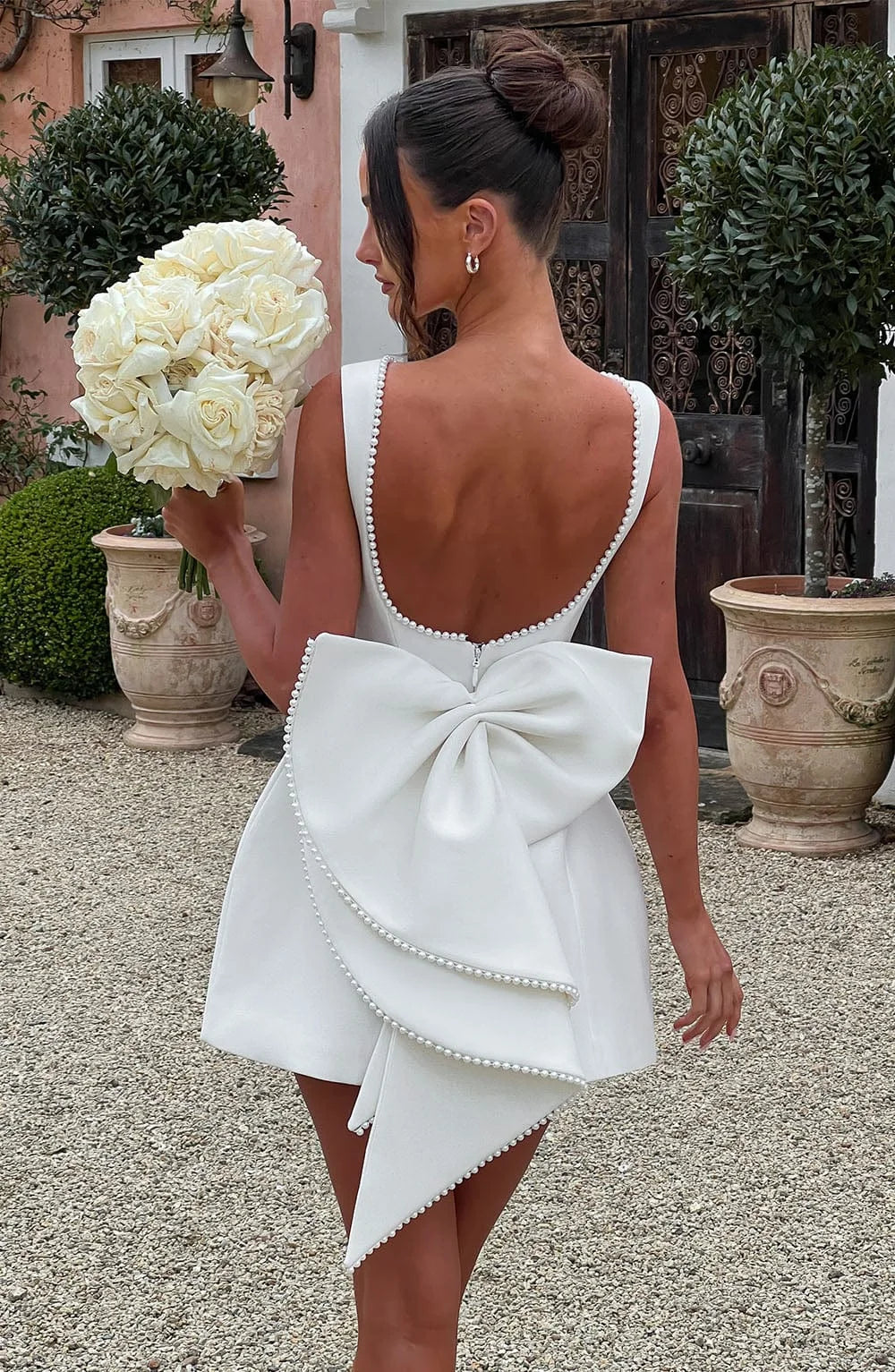 Short women's dress with decorative bow at the back