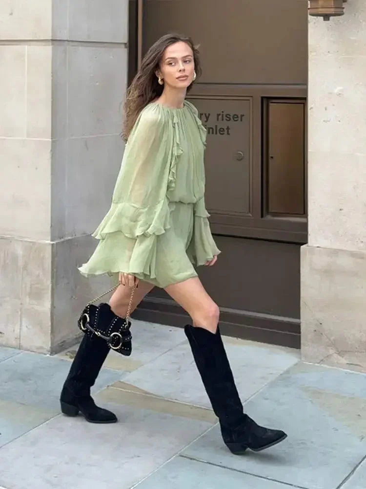 Short women's dress in light green with ruffles and long sleeves for evening wear