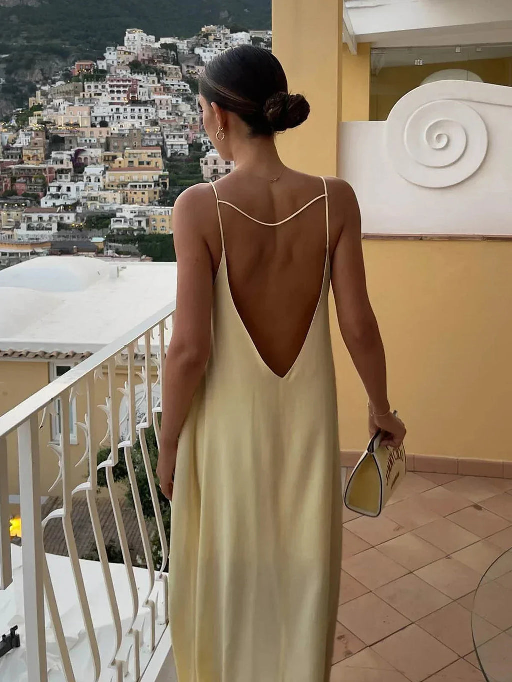 Long yellow backless dress for summer beach relaxation