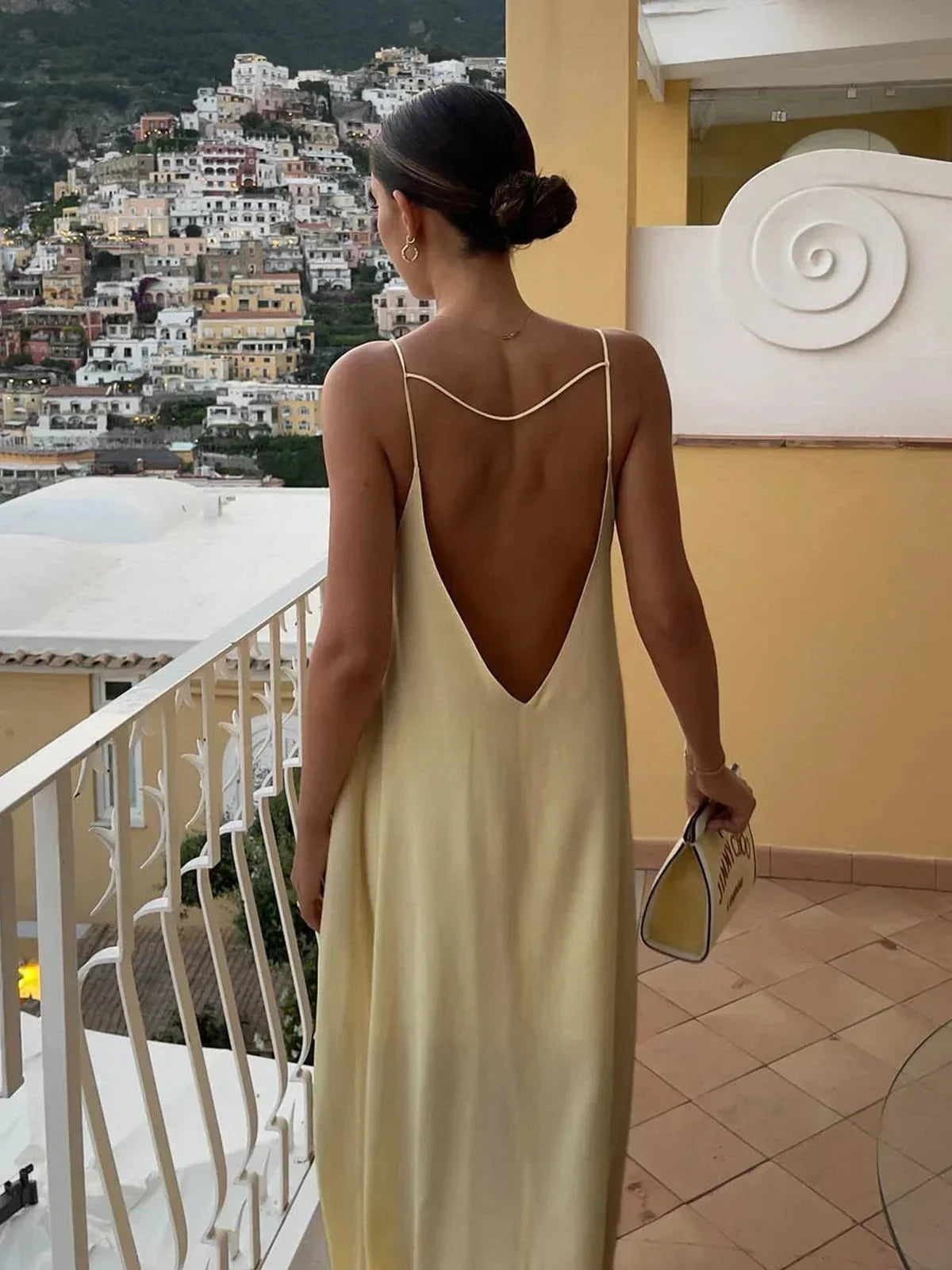 Long yellow backless dress for summer beach relaxation