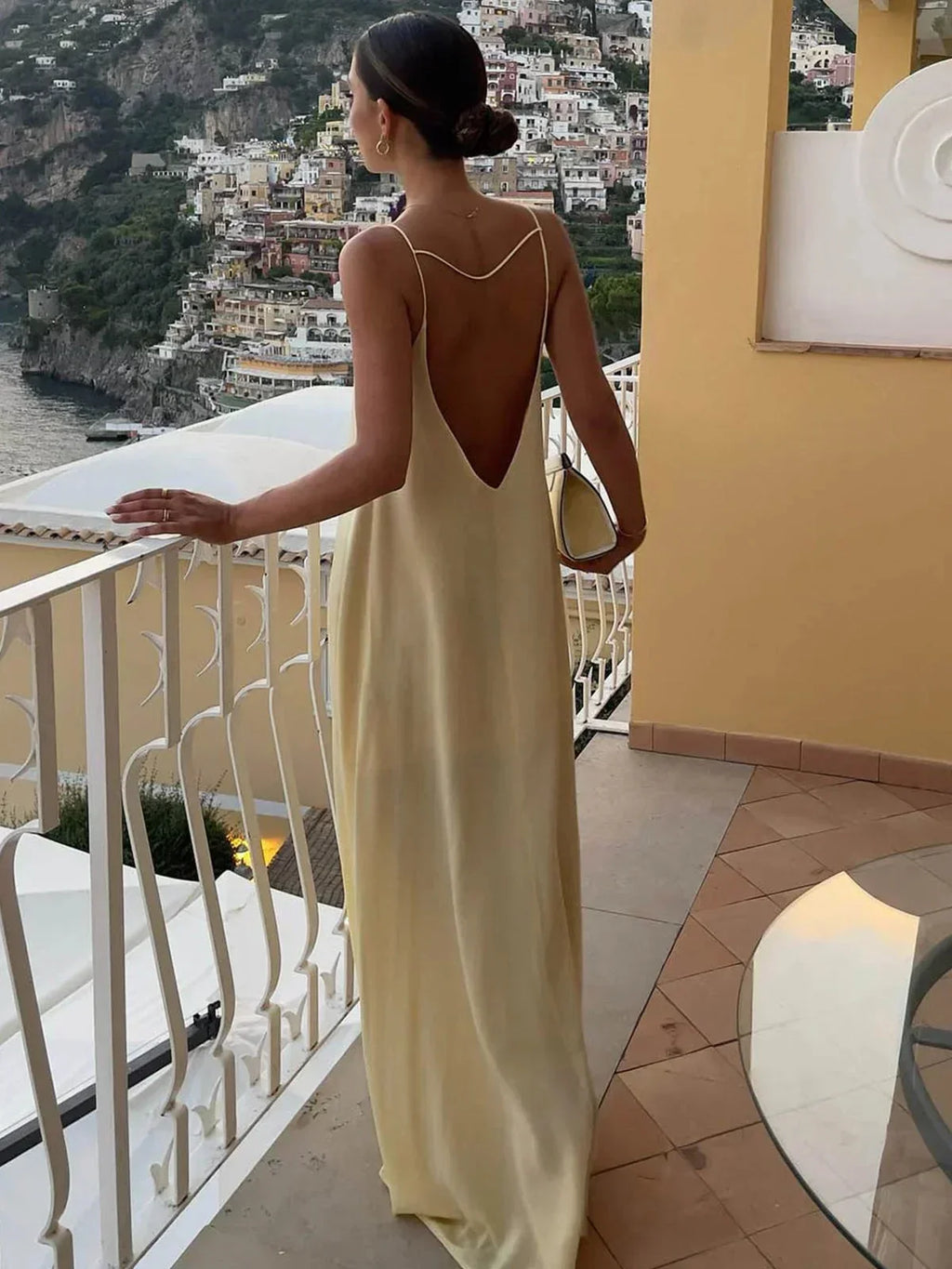 Long yellow backless dress for summer beach relaxation