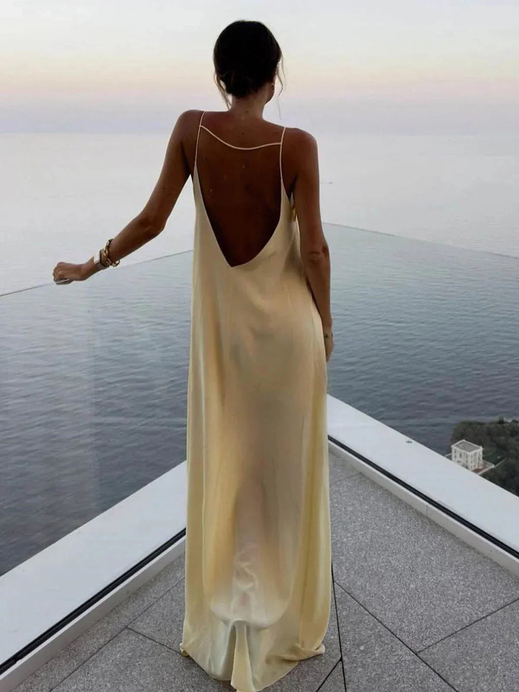 Long yellow backless dress for summer beach relaxation