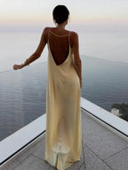 Long yellow backless dress for summer beach relaxation