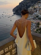 Long yellow backless dress for summer beach relaxation
