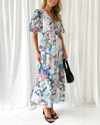 Long floral dress with long sleeves and V-neck for spring weddings
