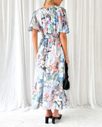 Long floral dress with long sleeves and V-neck for spring weddings