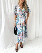 Long floral dress with long sleeves and V-neck for spring weddings