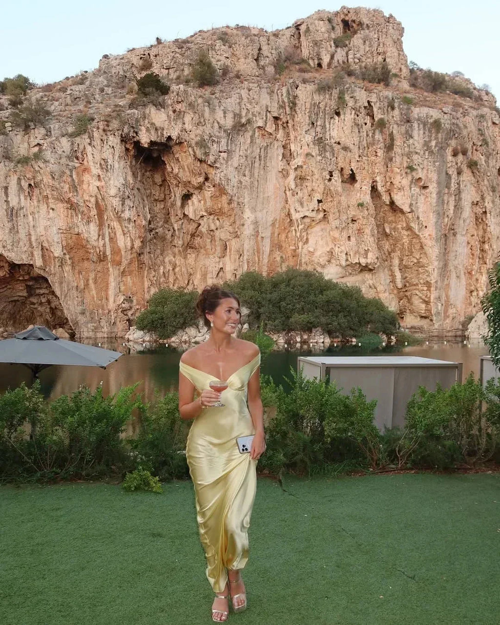 Long satin yellow dress with off-the-shoulder design for evening wear
