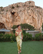 Long satin yellow dress with off-the-shoulder design for evening wear