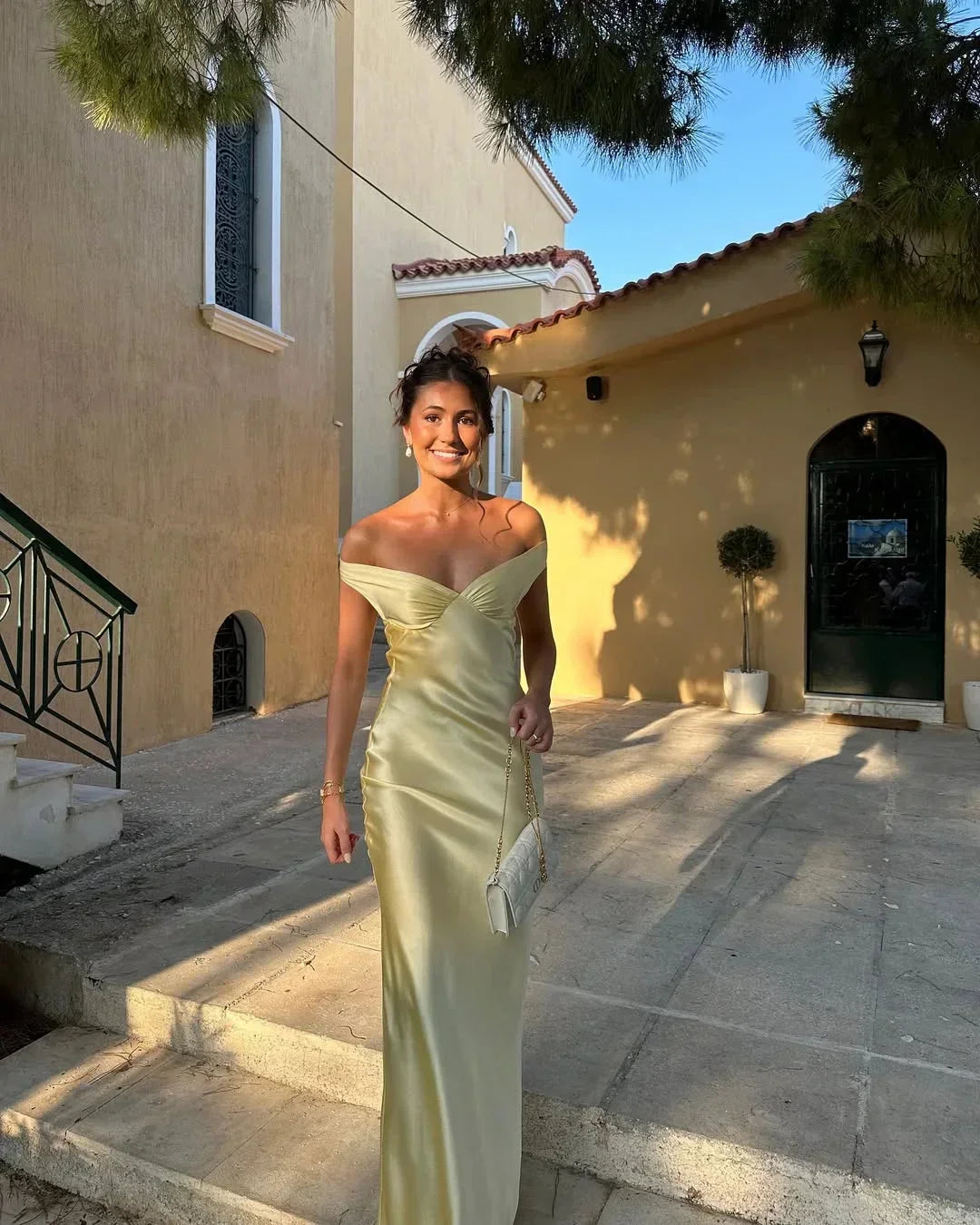 Long satin yellow dress with off-the-shoulder design for evening wear