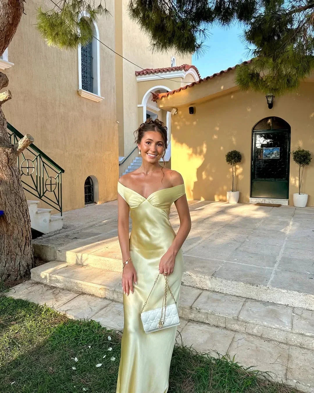 Long satin yellow dress with off-the-shoulder design for evening wear