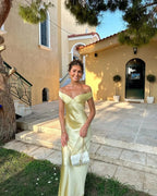 Long satin yellow dress with off-the-shoulder design for evening wear