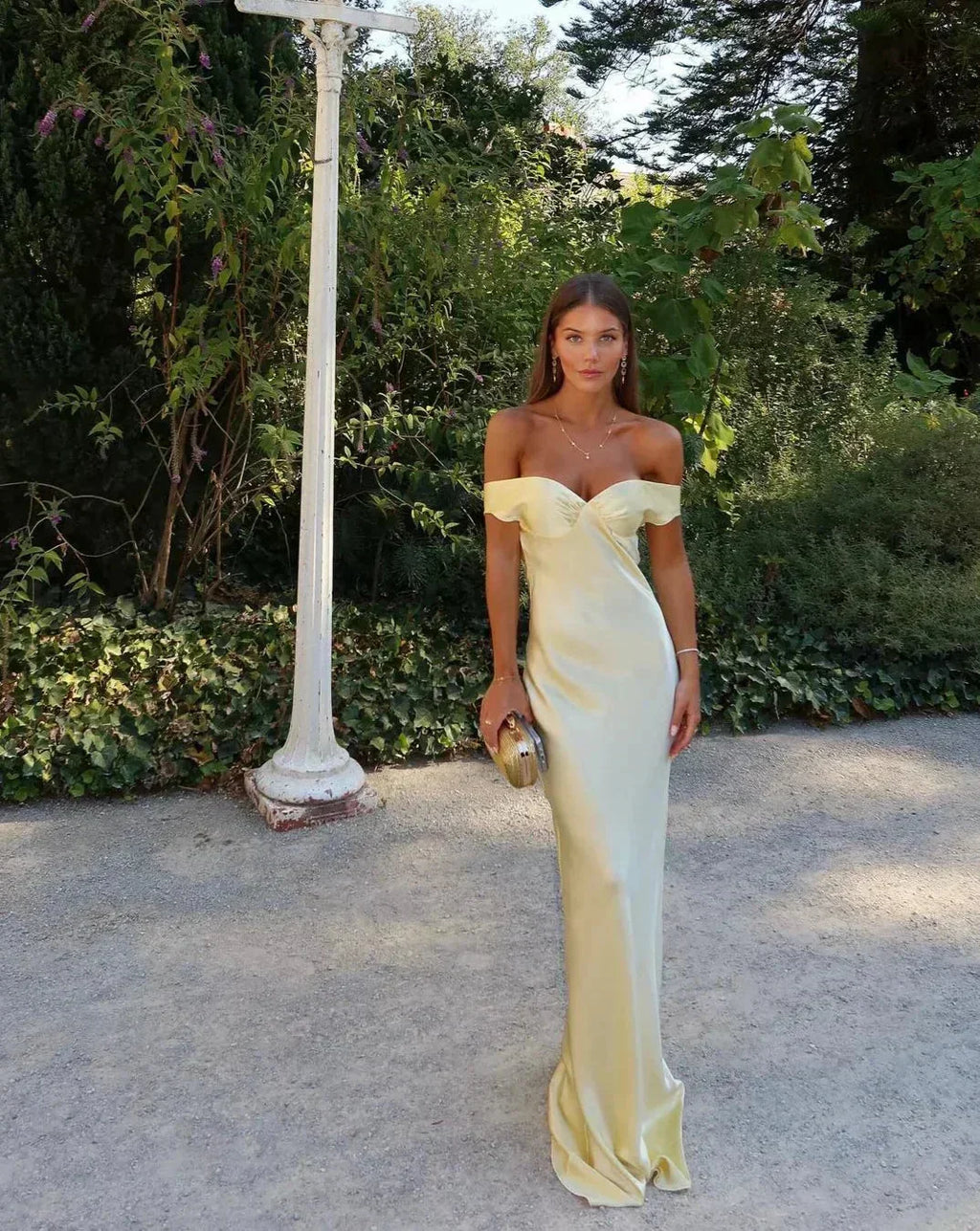 Long satin yellow dress with off-the-shoulder design for evening wear