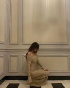 Long Shimmering Dress with Long Sleeves and Off-Shoulder Design