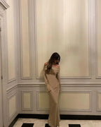 Long Shimmering Dress with Long Sleeves and Off-Shoulder Design