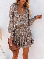 Short women's dress with ruffles and various prints