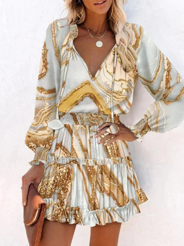 Short women's dress with ruffles and various prints