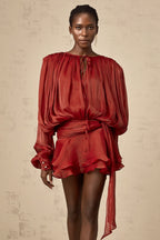 Short fluid dress with long sleeves and tied belt