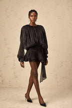 Short fluid dress with long sleeves and tied belt