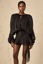 Short fluid dress with long sleeves and tied belt