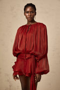 Short fluid dress with long sleeves and tied belt