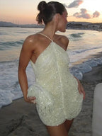 Short women's cocktail dress with sequins and halter neck