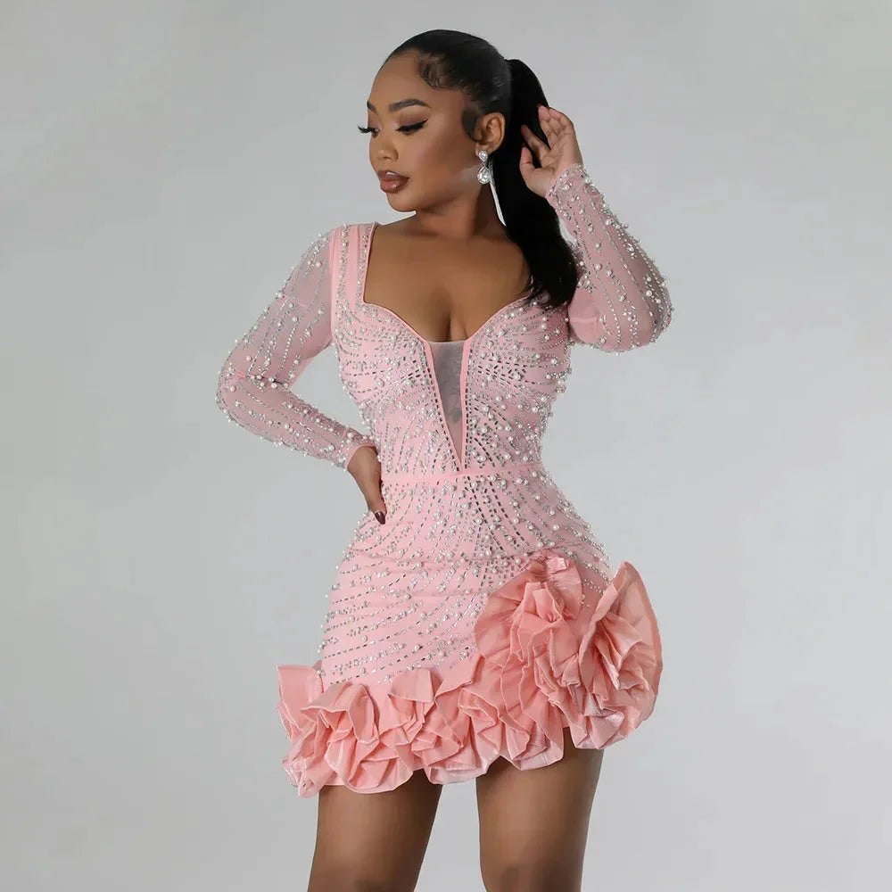 Short evening dress with plunging neckline and long sleeves