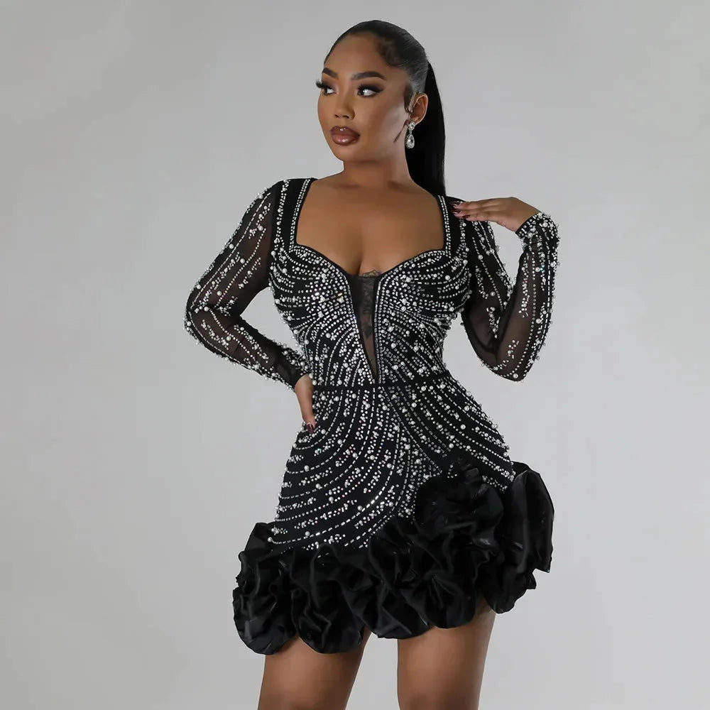 Short evening dress with plunging neckline and long sleeves