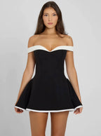 Short black dress with off-the-shoulder design and white trim